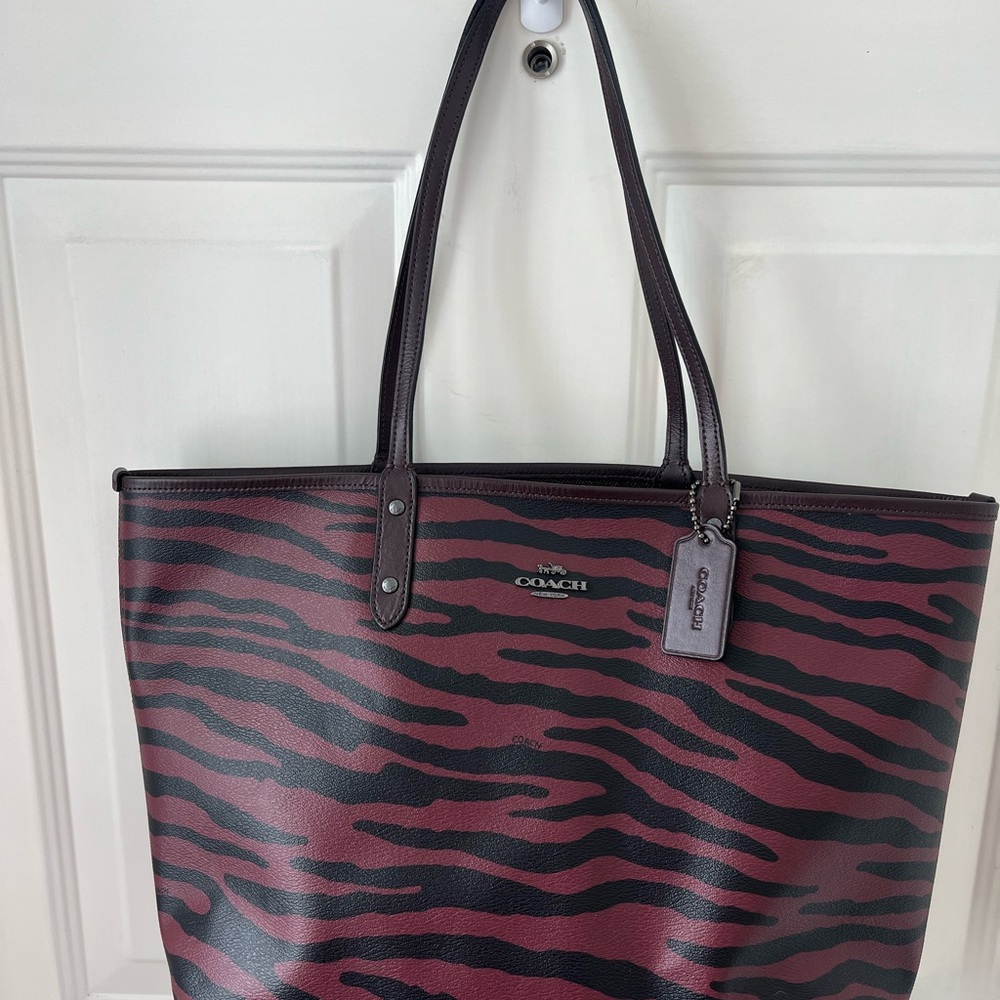 EUC Coach Reversible City Tote Burgundy with zebra print.